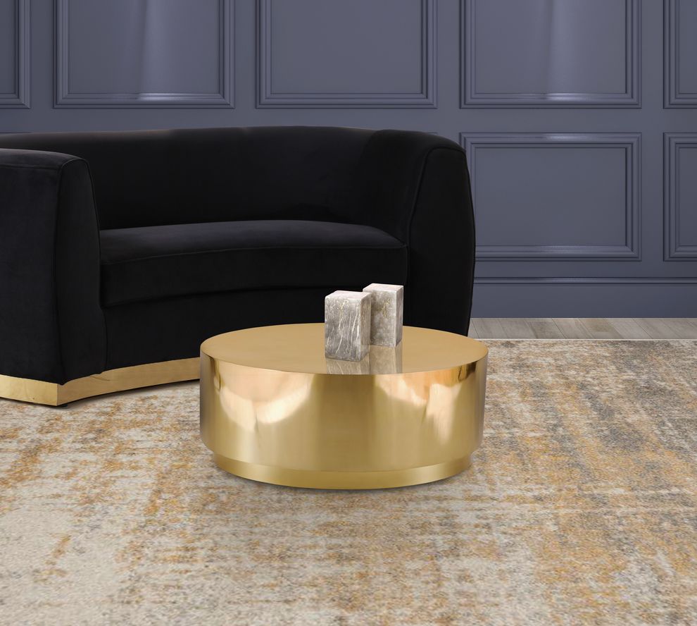 Gold metal round drum style coffee table by Meridian