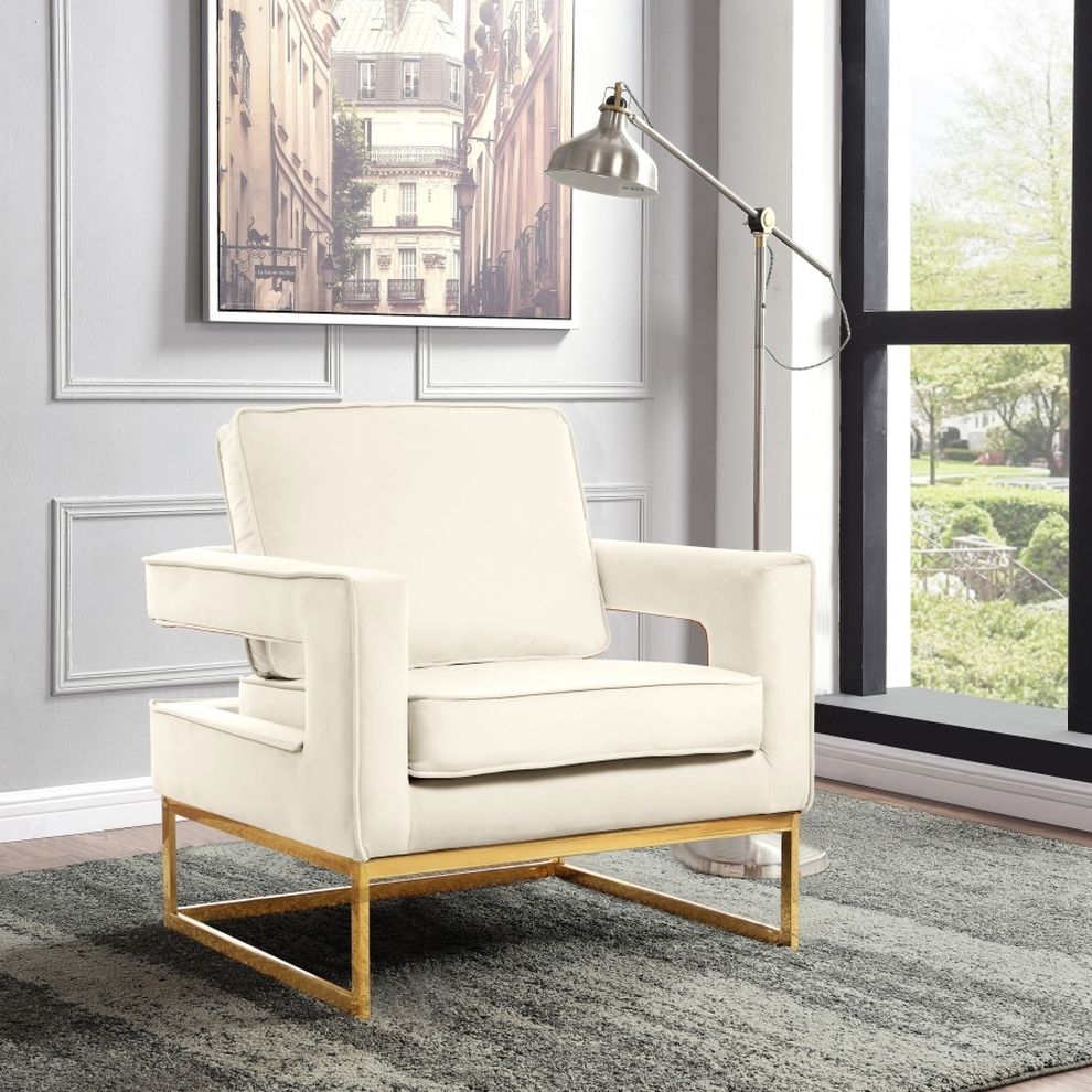 Gold stainless steel base chair in cream velvet fabric by Meridian