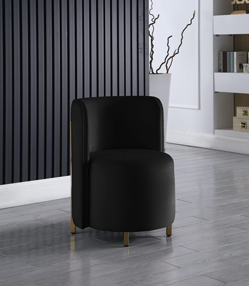 Rounded accent chair in black velvet by Meridian