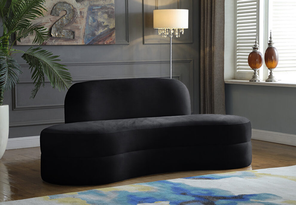 Kidney-shaped lounge style black velvet sofa by Meridian
