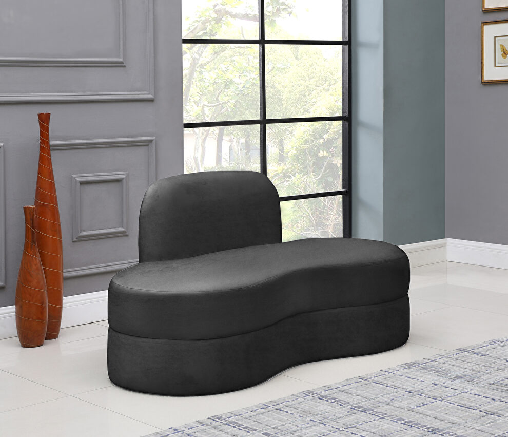 Kidney-shaped lounge style gray velvet loveseat by Meridian