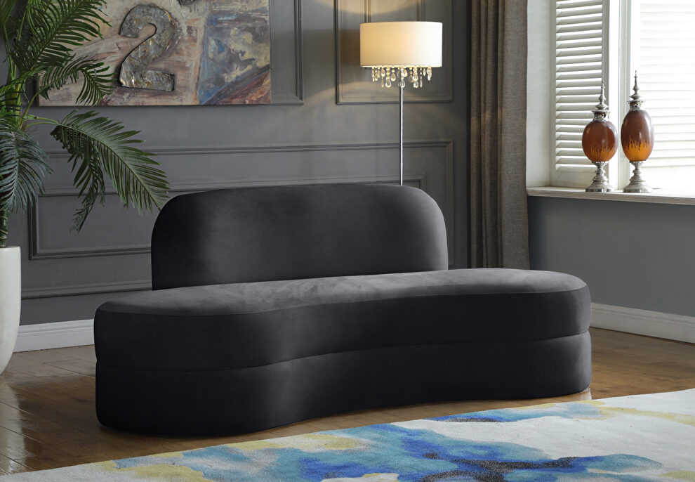 Kidney-shaped lounge style gray velvet sofa by Meridian