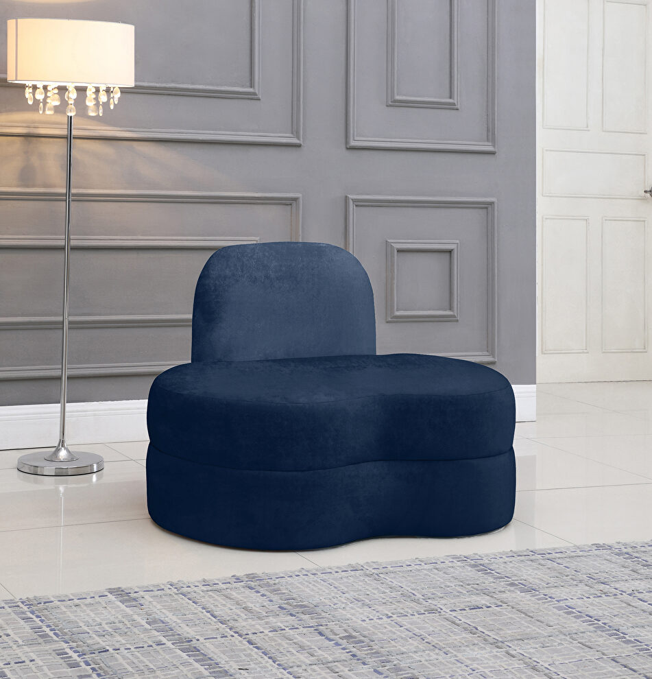 Kidney-shaped lounge style navy velvet chair by Meridian