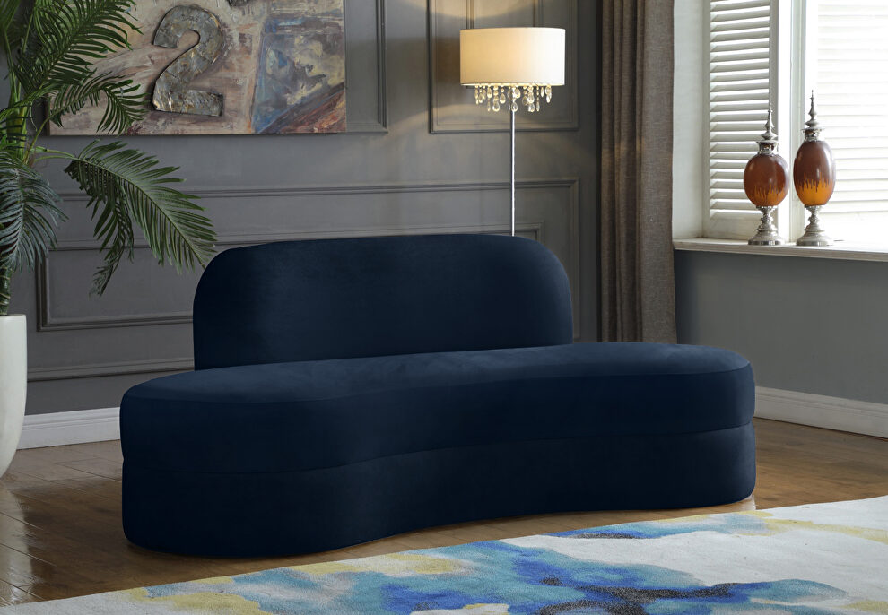 Kidney-shaped lounge style navy velvet sofa by Meridian