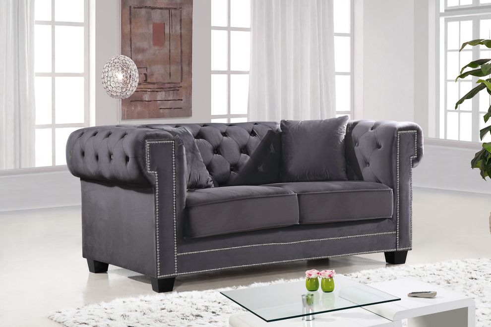 Gray fabric tufted seat & back loveseat by Meridian