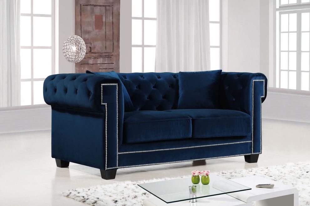 Navy fabric tufted seat & back loveseat by Meridian
