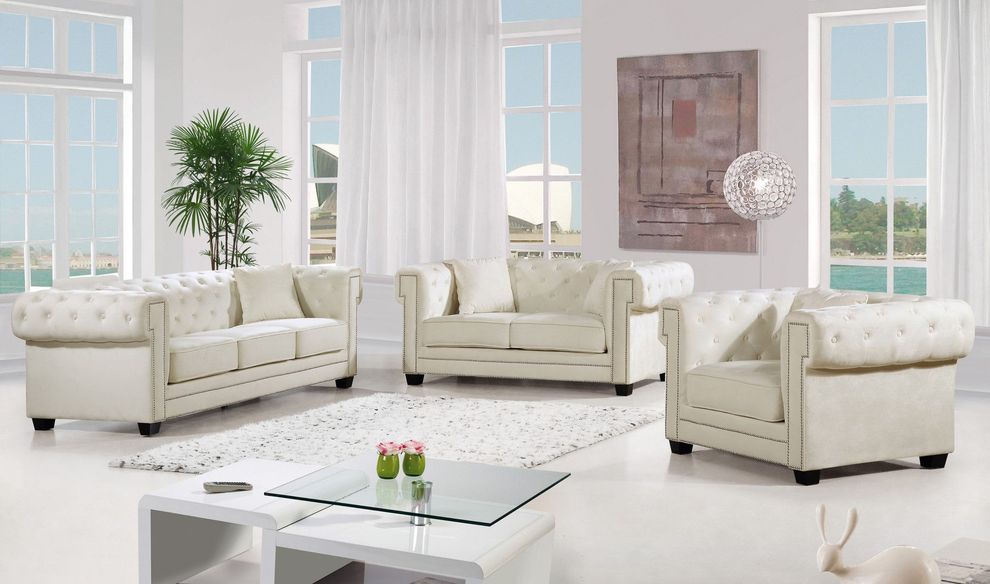 Modern cream fabric tufted back sofa w/ rolled arms by Meridian