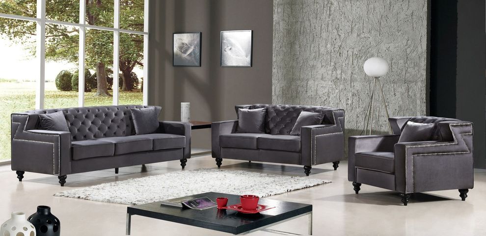 Tufted designer gray fabric sofa w/ nailhead trim by Meridian