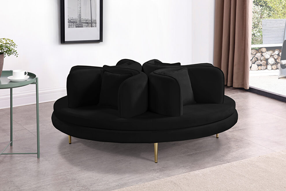 Round accent settee / couch with unique club-like design by Meridian