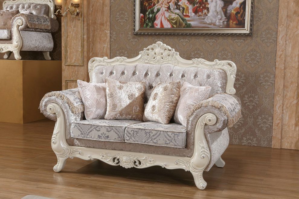 Rich fabric tufted traditional style loveseat by Meridian