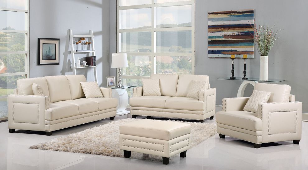 Nailhead trim design beige contemporary sofa by Meridian