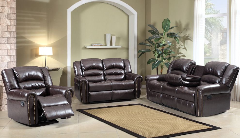 Nailhead espresso bonded leather reclining sofa by Meridian