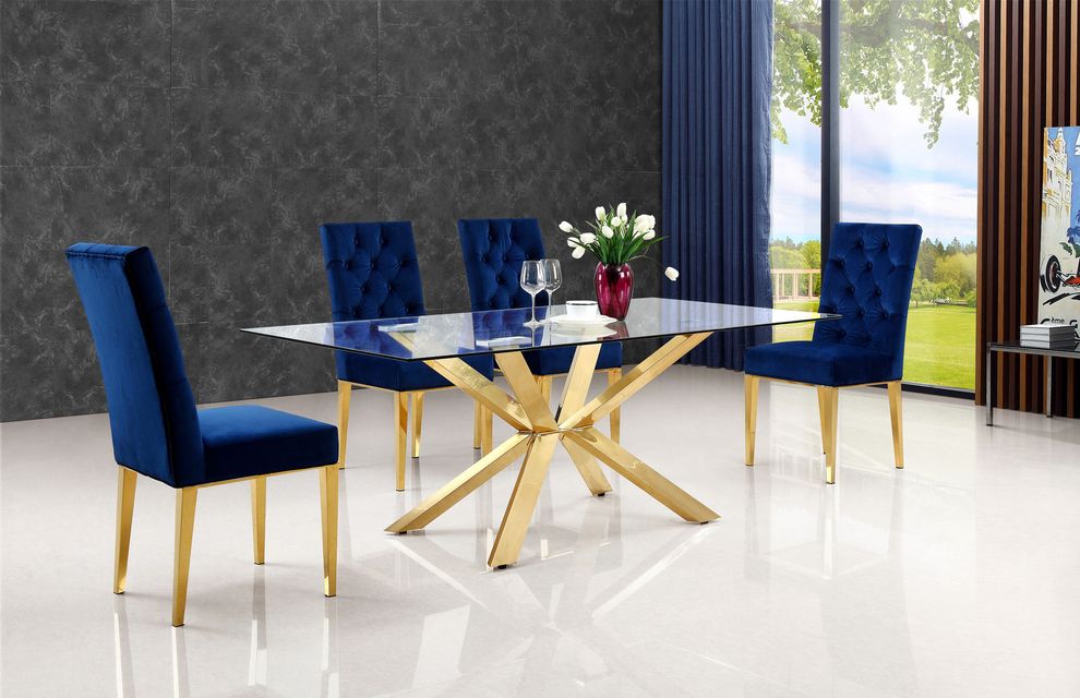 Rich gold stainless steel base / glass top table by Meridian