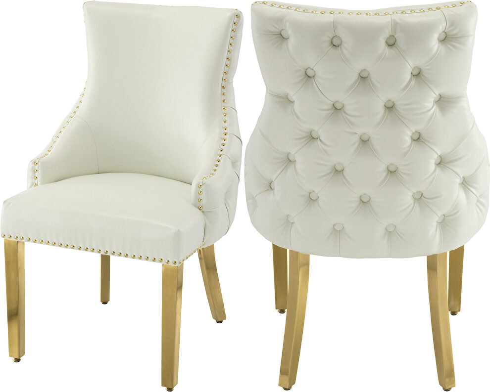 Elegant tufted faux leather dining chair w/ golden legs by Meridian