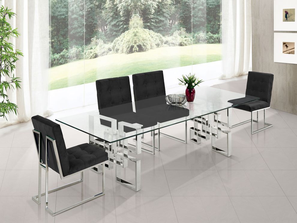 Glass top / stainless steel base modern table by Meridian