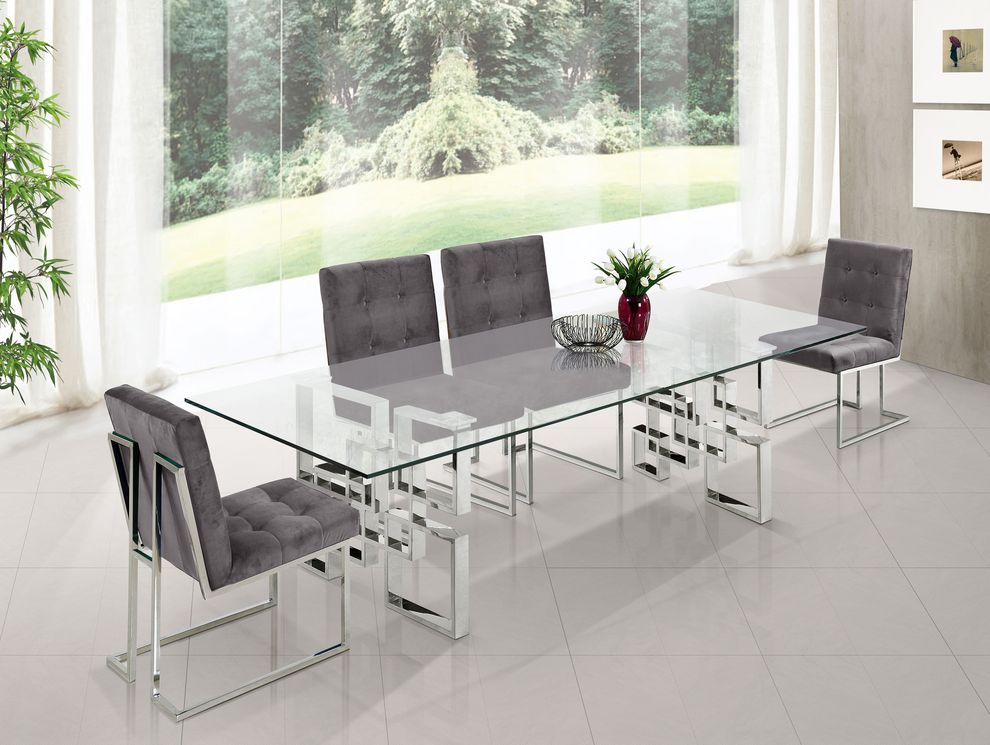 Glass top / stainless steel base modern table by Meridian