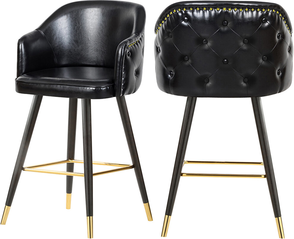 Rounded tufted back faux leather black / gold bar stool by Meridian