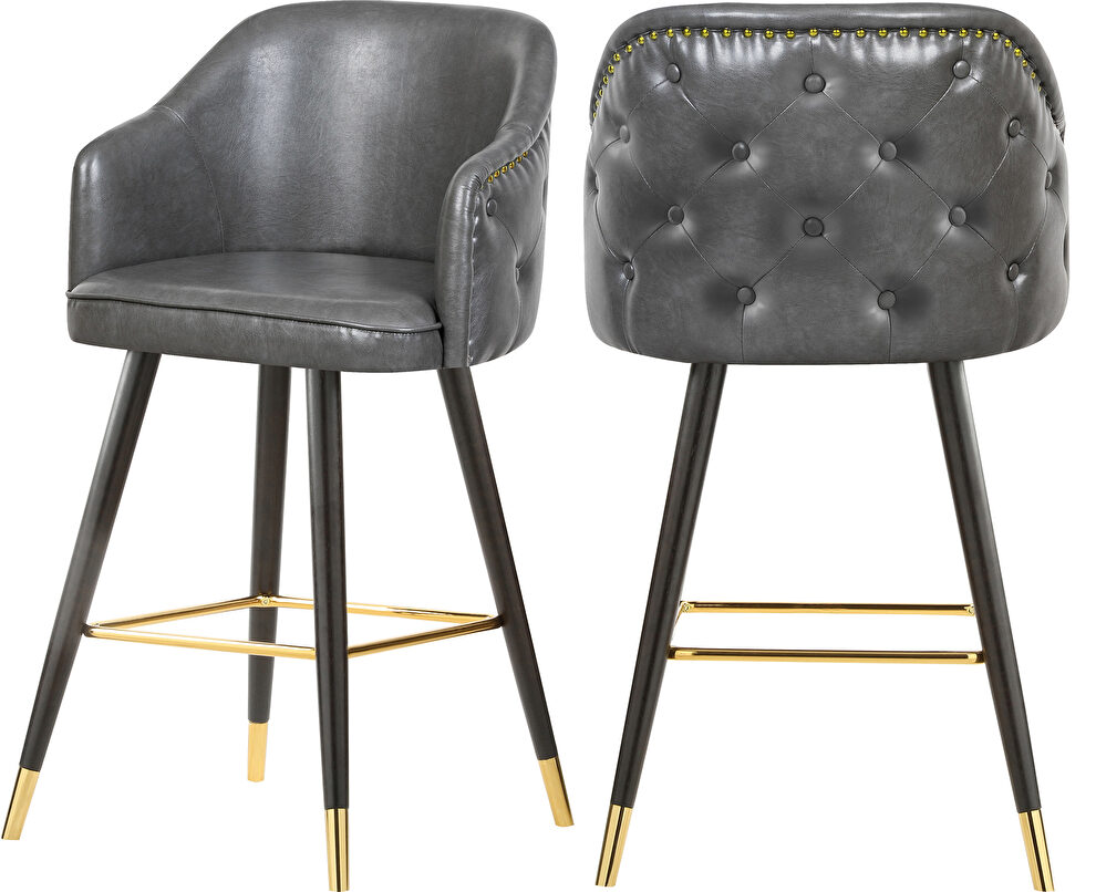 Rounded tufted back faux leather gray / gold bar stool by Meridian