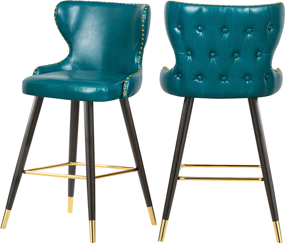 Stylish bar stool w/ golden trim and leg tips by Meridian