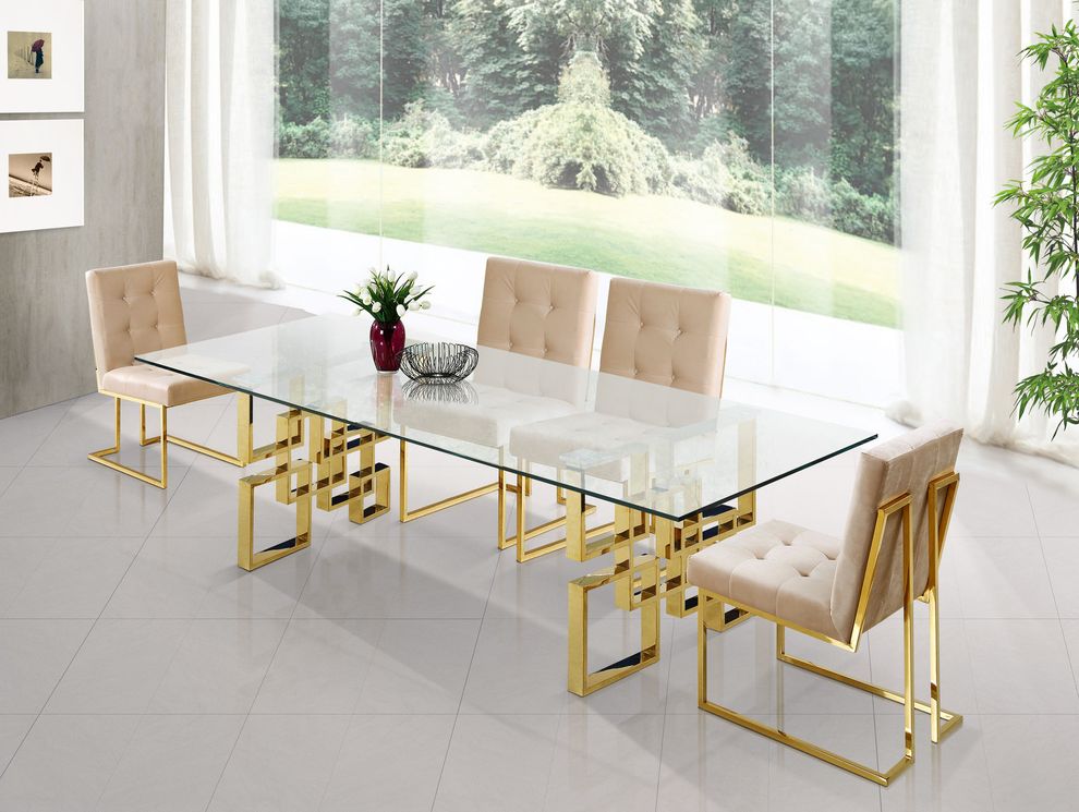 Glass top / golden metal base dining table by Meridian