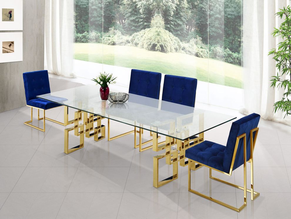 Glass top / golden metal base dining table by Meridian