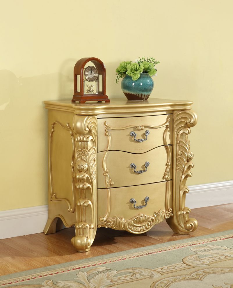 Gold finish nightstand by Meridian