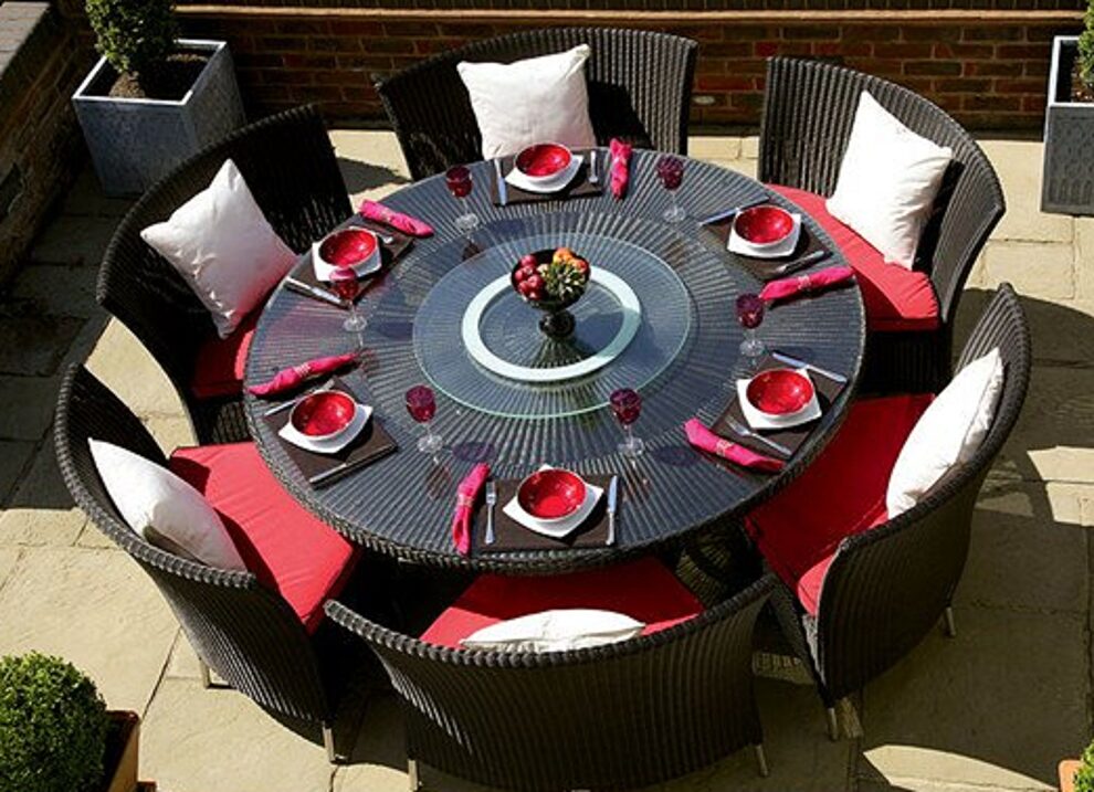Black 7-piece rattan outdoor dining set with red and white cushions by Manhattan Comfort