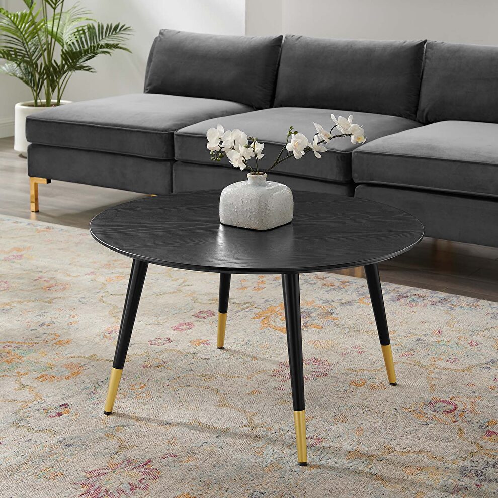 Round coffee table in black by Modway