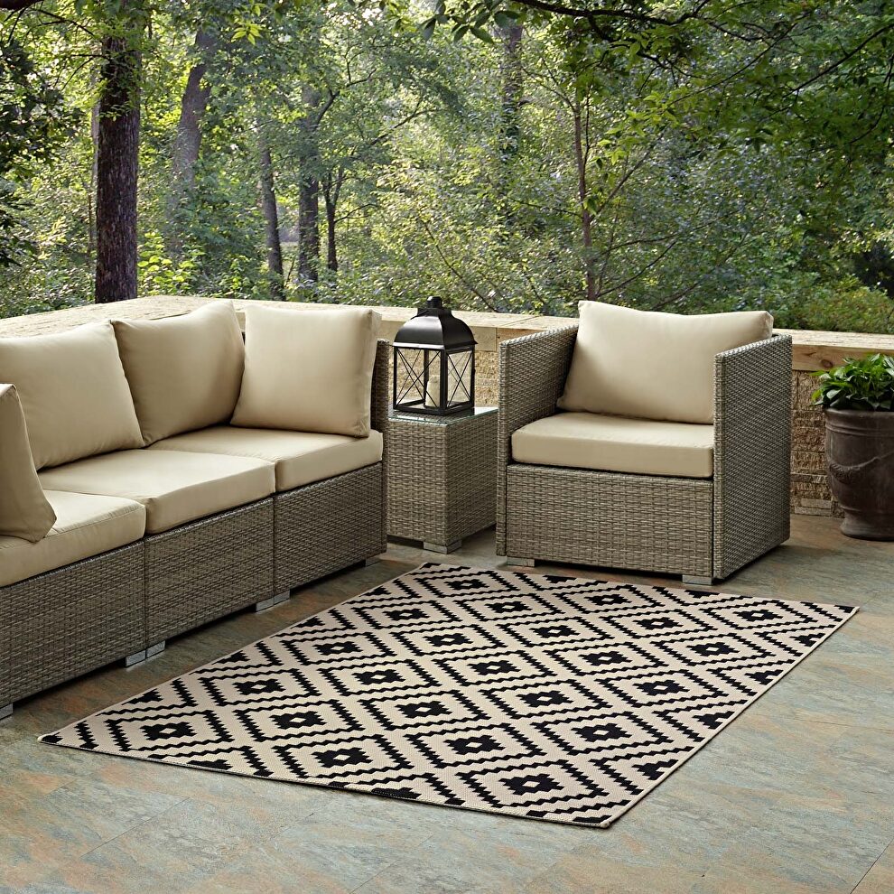 Geometric diamond trellis indoor and outdoor area rug in black and beige by Modway