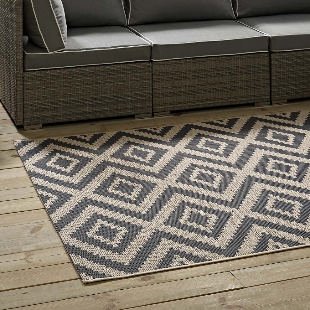 Geometric diamond trellis indoor and outdoor area rug in gray and beige by Modway