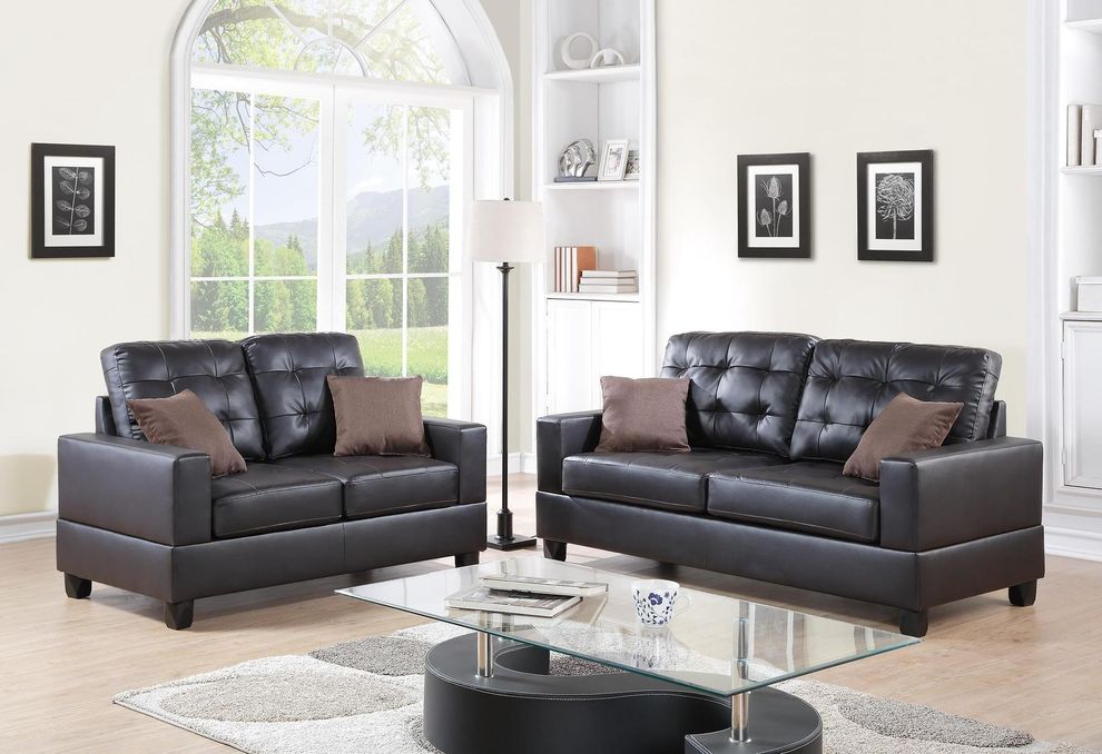 Espressso faux leather sofa and loveseat set by Poundex