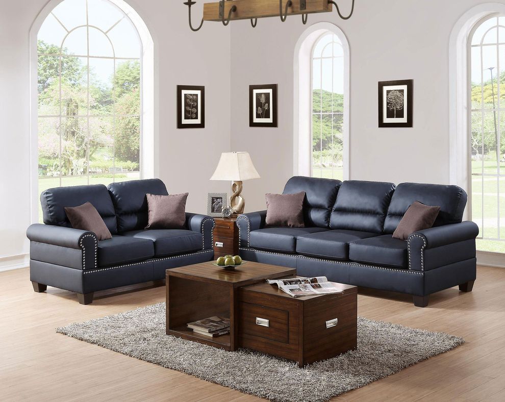 Faux leather black sofa and loveseat set by Poundex