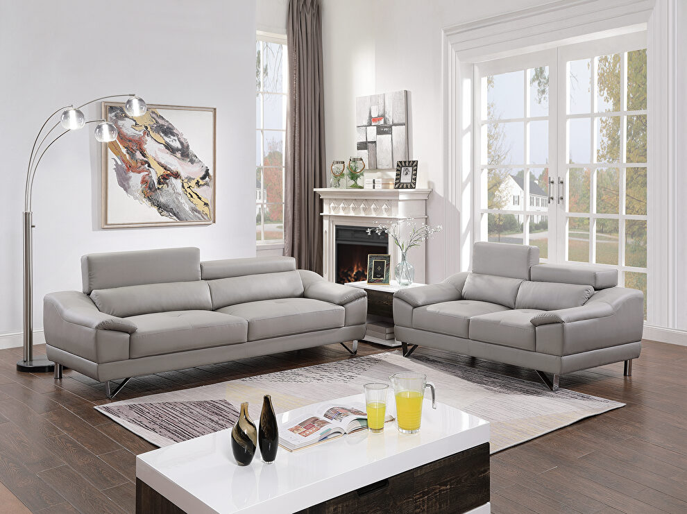 Gray faux leather sofa and loveseat set by Poundex