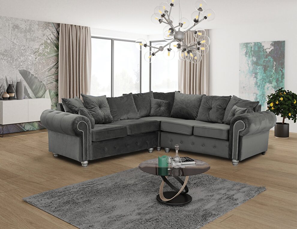 Sectional sofa in gray fabric w/ nailhead trim by Skyler Design