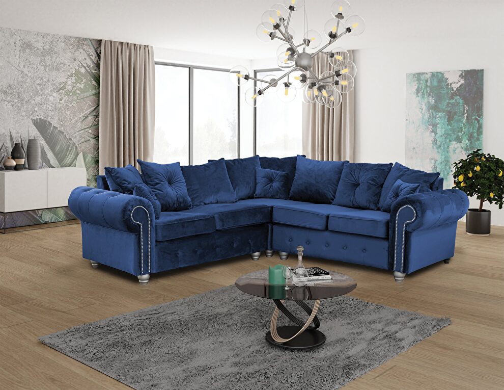 Sectional sofa in blue fabric w/ nailhead trim by Skyler Design