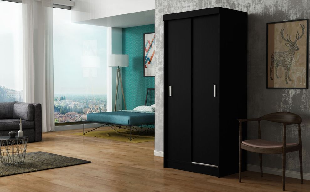 Black finish closet with storage/drawers by Skyler Design