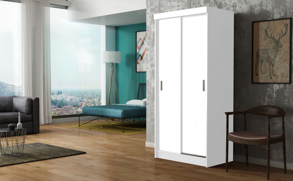 White finish closet with storage/drawers by Skyler Design
