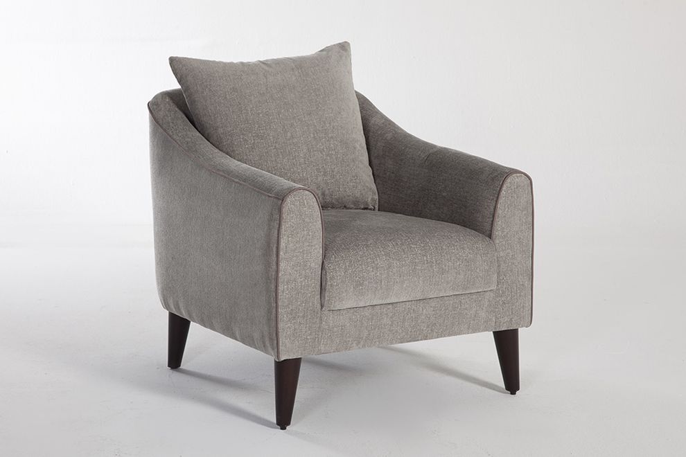 Gray accent chair by Istikbal