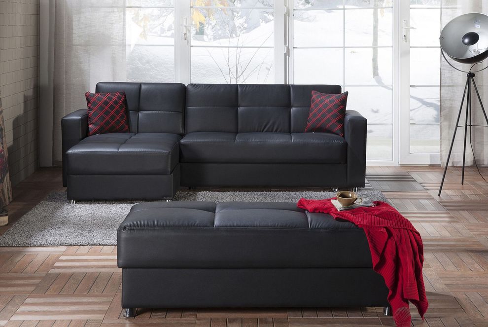 Black leatherette sectional + ottoman set by Istikbal