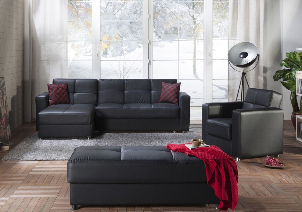 Black leatherette sectional + chair + ottoman set by Istikbal
