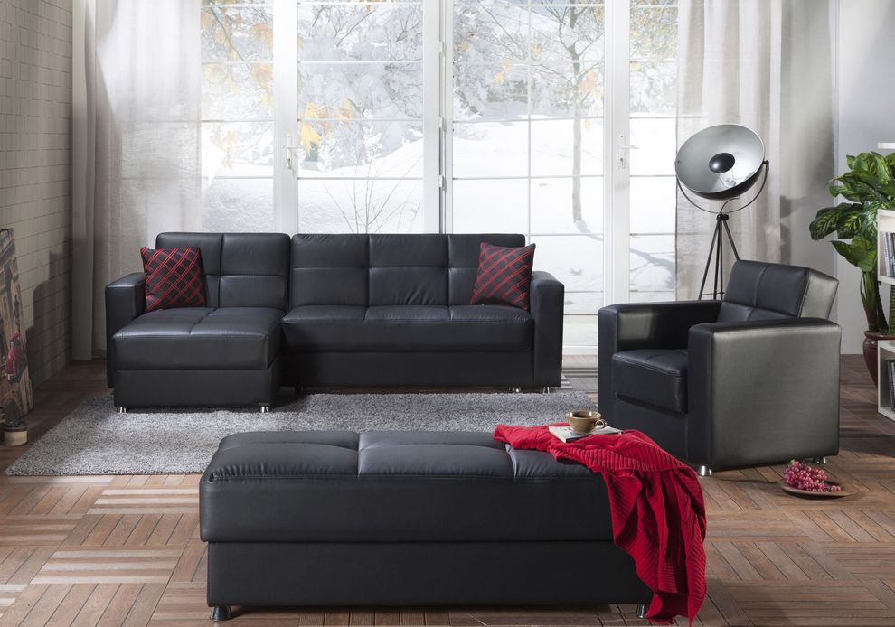 Black leatherette sectional sofa with sleeper & storage by Istikbal