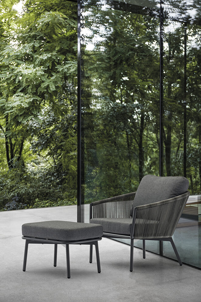 Indoor/outdoor dark gray wicker chair and ottoman by Whiteline 