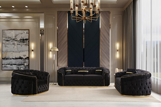Black velvet sofa in royal style w/ gold trim and deep tuftings