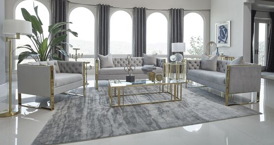 Glam style gray tufted sofa w/ golden steel legs