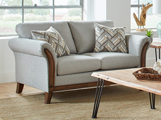 Blend of earth tones with soft shades of teal blue loveseat