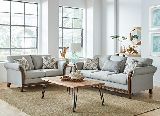 Blend of earth tones with soft shades of teal blue sofa
