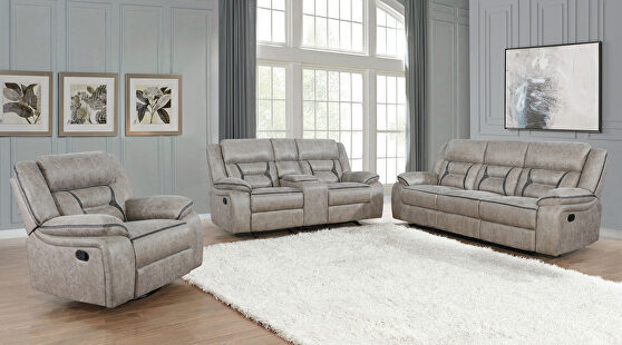 Motion sofa upholstered in taupe performance-grade leatherette