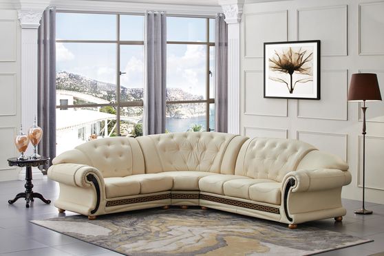 Italian ivory leather sectional in royal tufted design