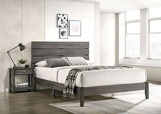 Gray plank-style headboard rustic bed