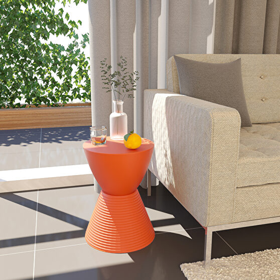 Orange smooth top over a ribbed design bottom side table